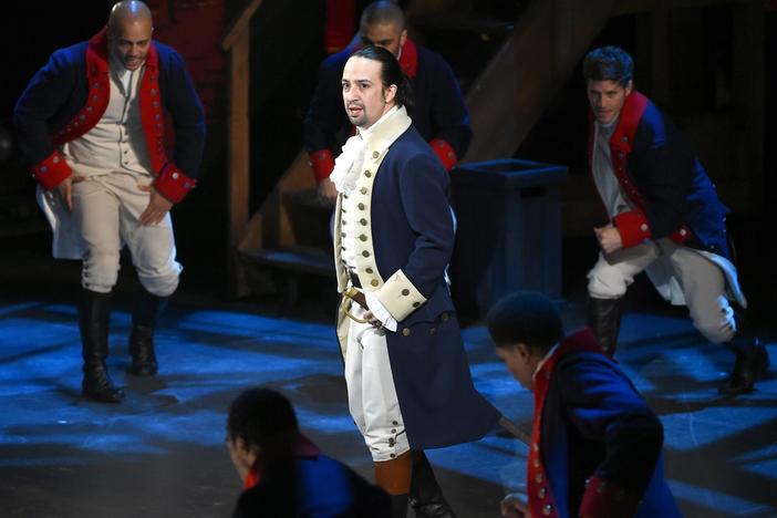 Lin-Manuel Miranda and the cast of <em>Hamilton</em> perform at the Tony Awards in 2016. The show has garnered near-universal acclaim since its 2015 opening.