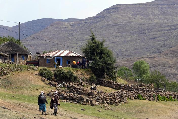 Women leave the poling station after casting their vote in Thaba-Tseka district, Lesotho, on Oct. 7, 2022.