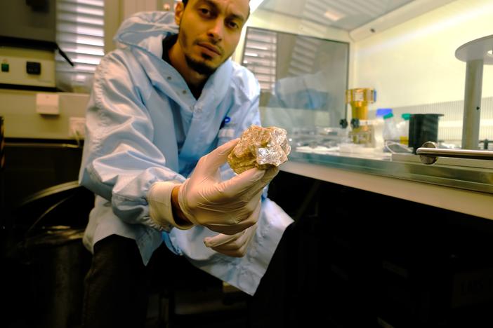 Youcef Sellam in his lab with the fossil filaments found in the gypsum.