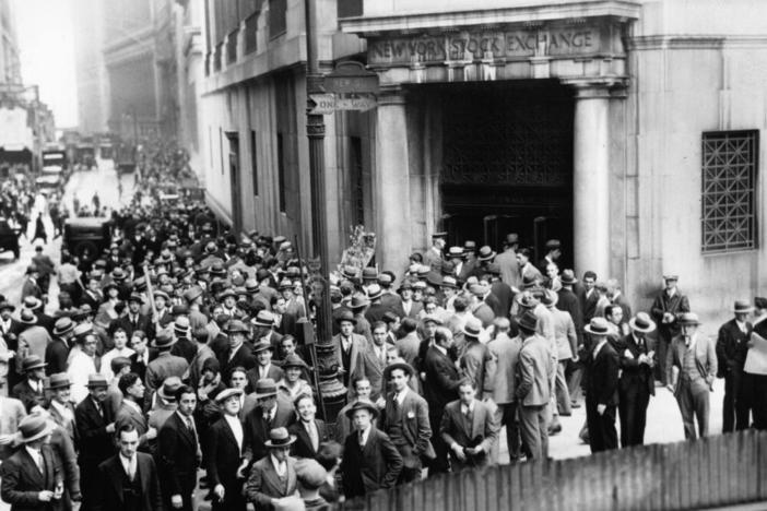 Crowds outside the New York Stock Exchange during the Wall Street Crash in the Financial District of Lower Manhattan, New York City, New York, Oct. 1929.