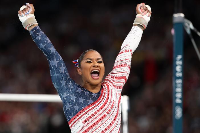 Jordan Chiles of Team USA reacts after finishing her routine on the uneven bars during the Olympic Games in Paris 2024.