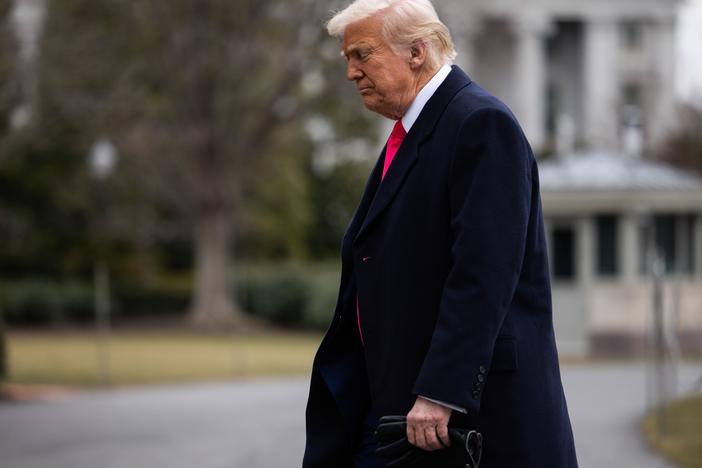 President Trump walks to the Residence after arriving to the White House on Feb. 22. The administration is facing legal challenges over its effort to freeze payments for federal grants and other programs.