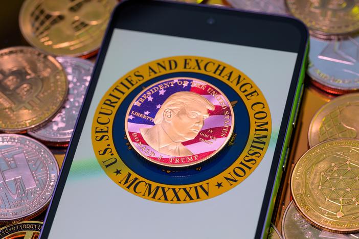 A photo illustration shows a representation of cryptocurrency coins with the $Trump meme coin (collection coin) in Brussels, Belgium, on Monday.