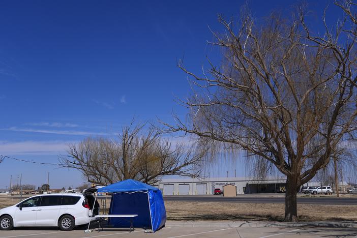 A van is seen at the site of a measles testing location in the parking lot of Seminole Hospital District on Feb. 21 in Seminole, Texas.