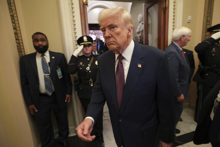 President Trump leaves the chamber after addressing a joint session of Congress on Tuesday. The administration is locked in a legal battle over the firing of the head of a federal watchdog agency.