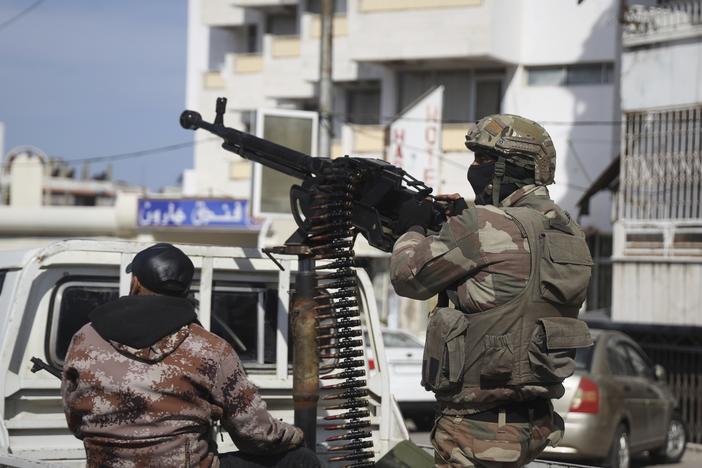 Syrian security reinforcements deploy in Latakia, Syria, on Friday.