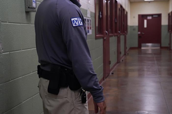 A security guard poses during a media tour of the Port Isabel Detention Center hosted by ICE in Los Fresnos, Texas in 2024. The Trump administration seeks to reopen family detention centers in the state.