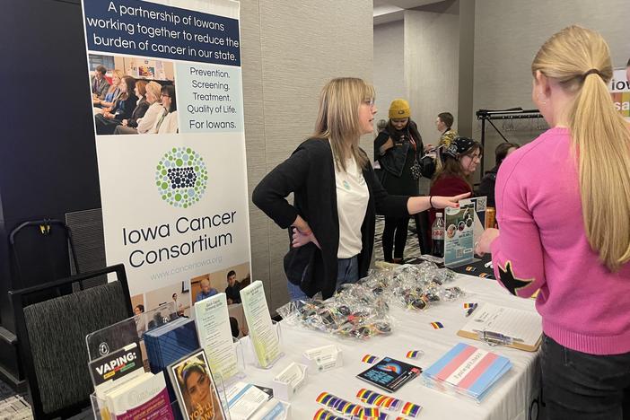 Bri McNulty does public health outreach at a conference in Iowa.