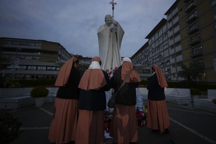 Nuns pray for Pope Francis on Saturday in front of the Agostino Gemelli Polyclinic in Rome, where the pontiff is hospitalized.