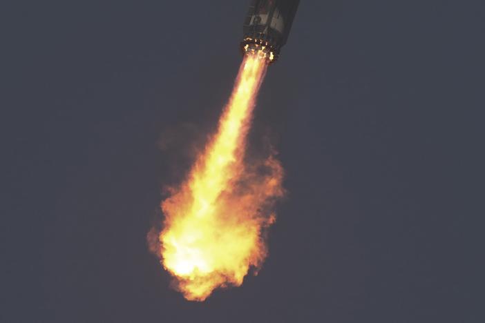 The booster of SpaceX's mega rocket Starship is recaptured during a test flight from Starbase in Boca Chica, Texas, on Thursday.