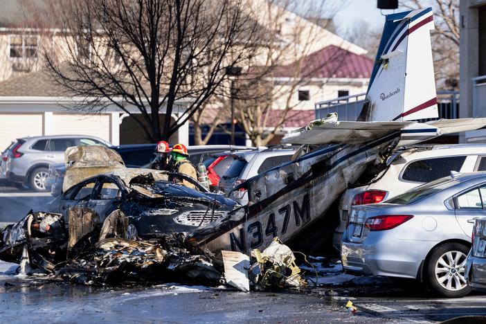 First responders work the scene after a plane crashed in the parking lot of a retirement community in Manheim Township, Pa. on Sunday.