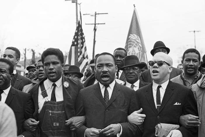 Rev. Ralph Abernathy, James Forman, Dr. Martin Luther King Jr. and Rev. Jesse Douglas lead the voting rights march to the Montgomery County Courthouse.