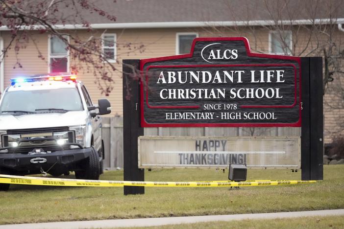 Emergency vehicles are parked outside the Abundant Life Christian School in Madison, Wis., following a shooting on Dec. 16, 2024.
