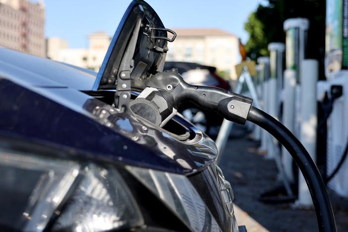 A Nissan LEAF recharges at a station in Pasadena, Calif. Memos obtained by NPR show a key federal agency has paused orders of zero-emission vehicles and some federally-owned EV chargers will be shut off.