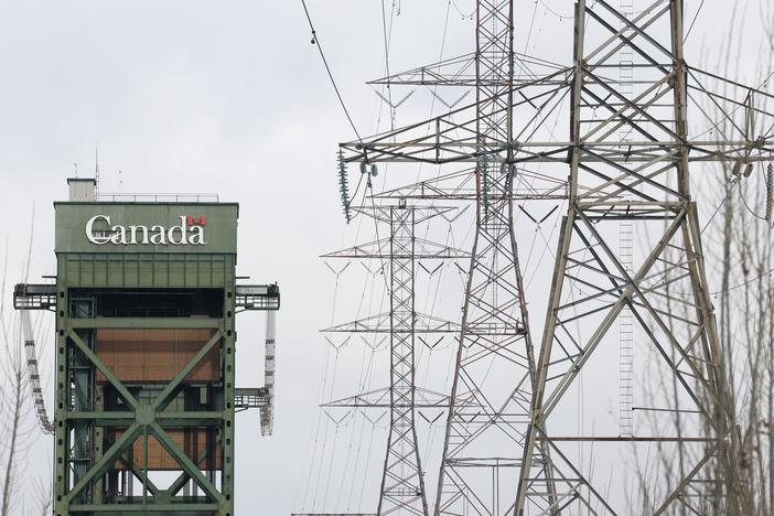 Power lines run near a bridge in Hamilton, Ontario, on Feb. 4. This week, Ontario's leader threatened a surcharge on Canadian electricity sold in some U.S. states in retaliation for President Trump's tariffs.