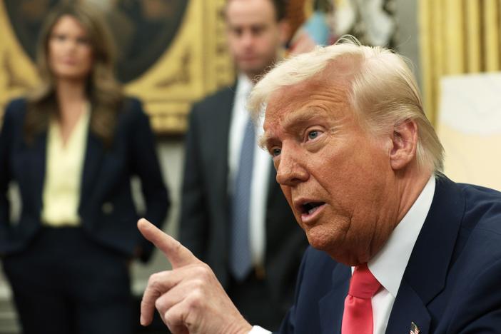 President Trump speaks after signing executive orders in the Oval Office of the White House on March 6, including one to lift 25% tariffs for all goods compliant under USMCA trade agreement.