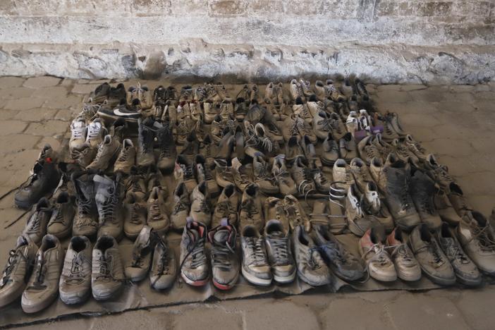 This photo released by the Jalisco State Attorney General's Office shows shoes at the Izaguirre Ranch where skeletal remains were also discovered in the municipality of Teuchitlan, Mexico on Tuesday.