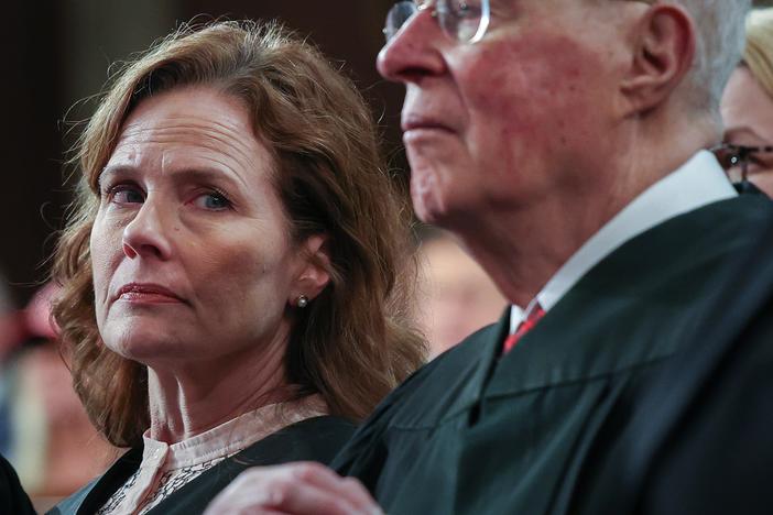 Supreme Court Justice Amy Coney Barrett and retired Supreme Court Justice Anthony Kennedy listen as President Trump addresses a joint session of Congress at the U.S. Capitol on March 4.