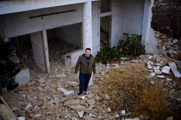 Abdulwahab Omira, 28, stands in front of his destroyed family home in Damascus, Syria. Omira and his family fled Syria's civil war in 2012 when he was a teenager. Now a U.S. citizen and a graduate student at Stanford, Omira recently returned to his home country to look for ways the tech industry could help rebuild it.