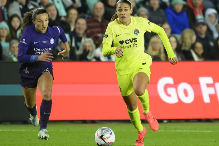 Orlando Pride defender Kerry Abello (left) and Washington Spirit forward Trinity Rodman chase after the ball during the first half of the NWSL championship at CPKC Stadium in Kansas City, Mo. on Nov. 23, 2024.