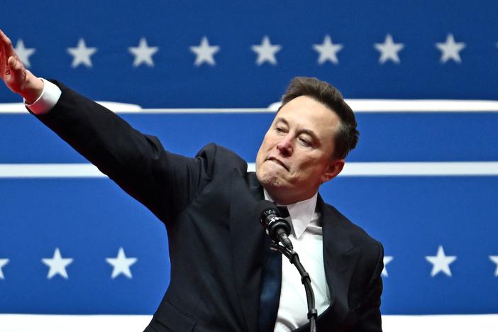 Elon Musk salutes as he speaks during an inaugural event in Washington, DC, on Jan. 20, 2025.