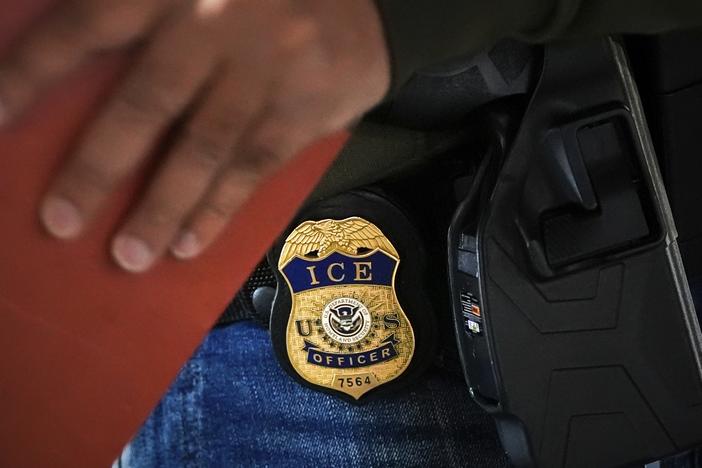 A deportation officer with U.S. Immigration and Customs Enforcement conducts a brief before an early morning operation, Dec. 17, 2024, in the Bronx borough of New York.