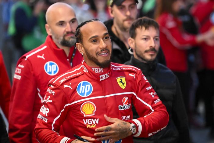 British F1 driver Lewis Hamilton signs autographs during the Ferrari Drivers' presentation event in Piazza Castello in Milan, Italy, on March 6, 2025. For the first time in a dozen years, Hamilton has a new team as he aims to return his F1 winning ways.