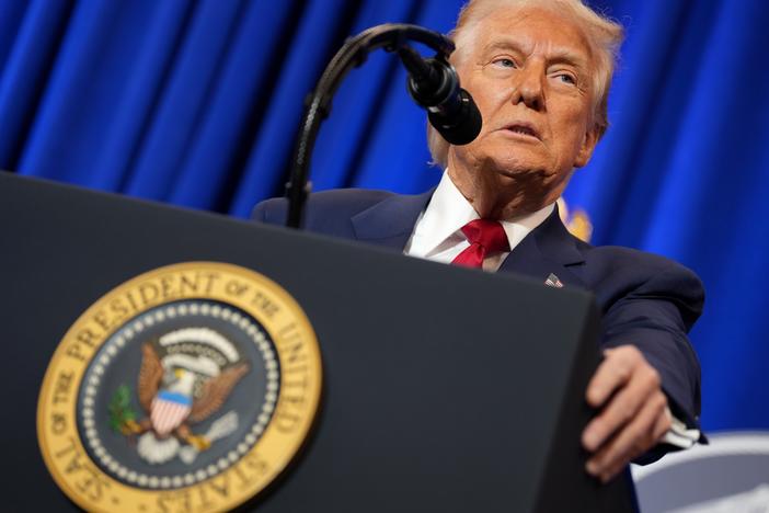 President Trump speaks at the Justice Department on Friday.