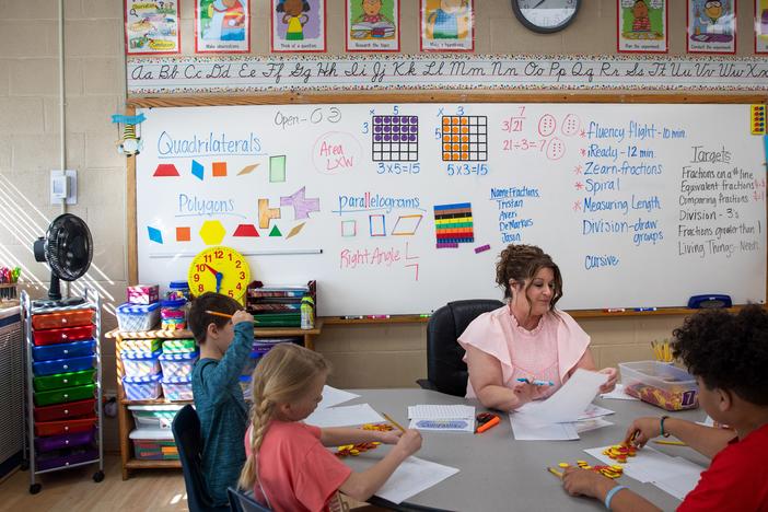 Math teacher Diane Laney hard at work in her third-grade classroom at Ider High school, which serves grades K-12. Students use counters to help model multiplication.