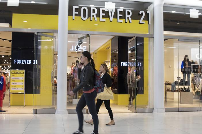 People walk in front of a Forever 21 clothing store in New York.
