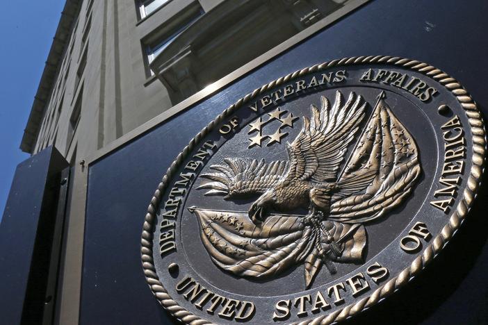 The seal of the Department of Veterans Affairs is seen outside the agency's building in Washington, D.C. The VA says it will no longer offer medical treatment for gender dysphoria to veterans.