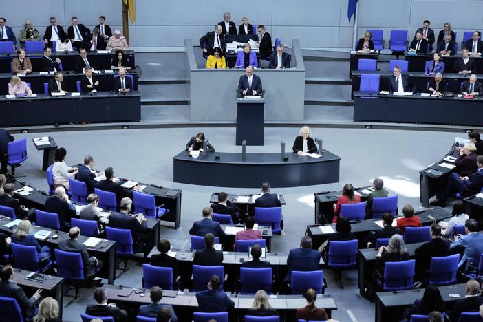 German opposition leader and Christian Democratic Union party chairman Friedrich Merz, right, speaks during a debate about loosening the country's debt rules in the Bundestag in Berlin, Germany, Tuesday.