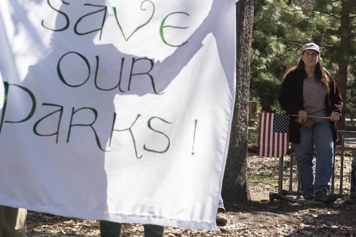 People demonstrate during a protest against federal employee layoffs at Yosemite National Park, California on March 1, 2025. Many workers at the U.S. Department of Interior and other agencies are being reinstated following court orders.