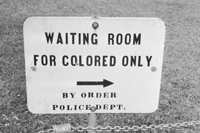 A sign in Jackson, Miss., in May 1961. The contract clause deleted from federal regulations last month dated back to the mid-1960s and specifically said entities doing business with the government should not have segregated waiting rooms, drinking fountains or transportation.
