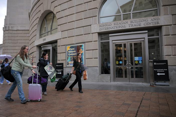 Former U.S. Agency for International Development employees terminated after the Trump administration effectively dismantled the agency collect their personal belongings at USAID headquarters on Feb. 27 in Washington, D.C.