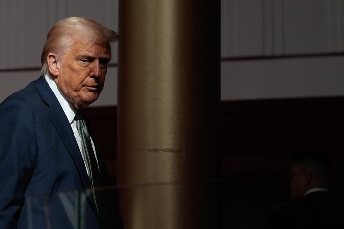 President Trump departs after speaking with reporters in the Grand Foyer during a tour at the John F. Kennedy Center for the Performing Arts on Monday.
