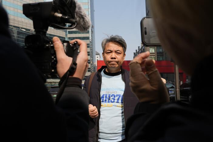 Jiang Hui, whose mother was on the missing MH370 Malaysia Airlines passenger jet, wears a shirt "Remembering 239 Lives, MH370" as he talks to media on the 11th anniversary of the jet going missing on March 8, 2025, in Beijing, China.