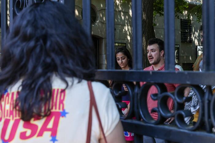 Columbia University student Mahmoud Khalil (R) talks to the press during a press briefing organized by Pro-Palestinian protesters in June 2024.