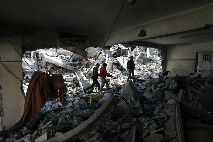 Palestinian children walk amid rubble of destroyed houses after Israeli attacks in Jenin camp, the occupied West Bank, on Feb. 26.