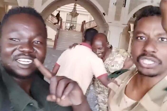 Sudanese army members film themselves inside the presidential palace, as the Sudanese army says they have taken control of the building, in Khartoum, Sudan, March 21, 2025, in this screengrab obtained from a social media video.