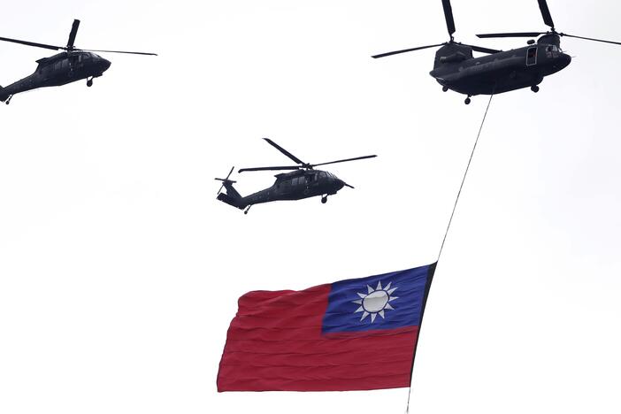 Helicopters fly over with Taiwan national flag during an inauguration celebration of Taiwan's President Lai Ching-te in Taipei, Taiwan, on May 20, 2024.