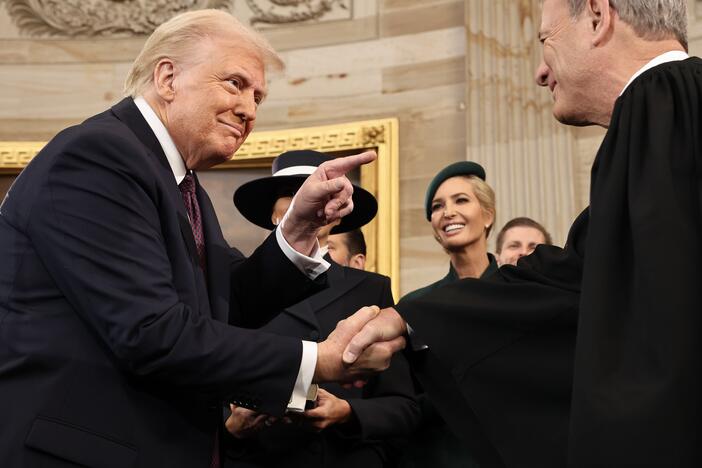 President Donald Trump gestures to U.S. Chief Justice John Roberts after his swearing-in ceremony in the Rotunda of the U.S. Capitol on Jan. 20.