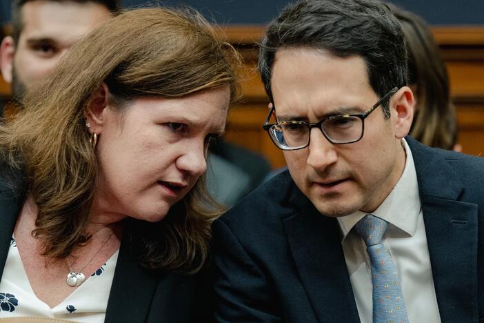 Democratic members of the Federal Trade Commission Rebecca Kelly Slaughter and Alvaro Bedoya chat during a House Judiciary Committee hearing on July 13, 2023. President Trump fired both on March 18.