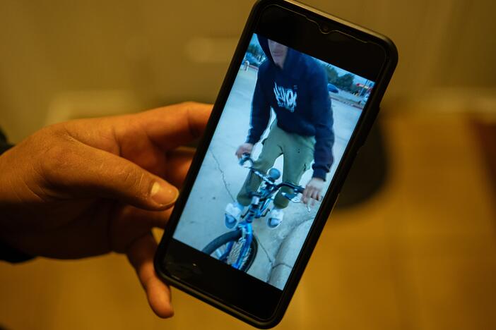 Juan plays a video of his son Carlos riding a bike, which Carlos purchased the day before being taken into custody, at his home in Cedar Park, Texas, on Jan. 29, 2025.