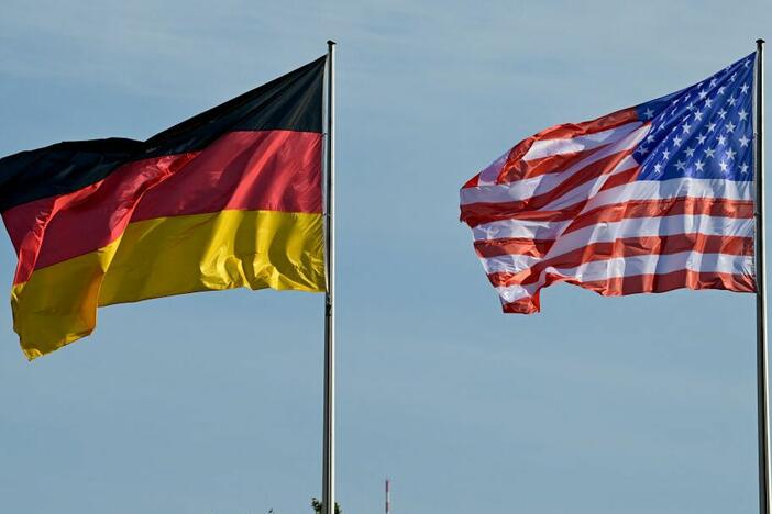 The German and the U.S. flags fly in front of the Chancellery in Berlin, on Oct. 18, 2024.