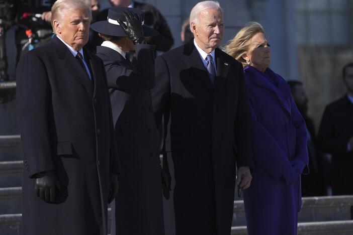 President Trump and first lady Melania Trump stand before sending off former President Joe Biden and Jill Biden to board a Marine helicopter en route to Joint Base Andrews after the inauguration on Jan. 20, at the U.S. Capitol in Washington.