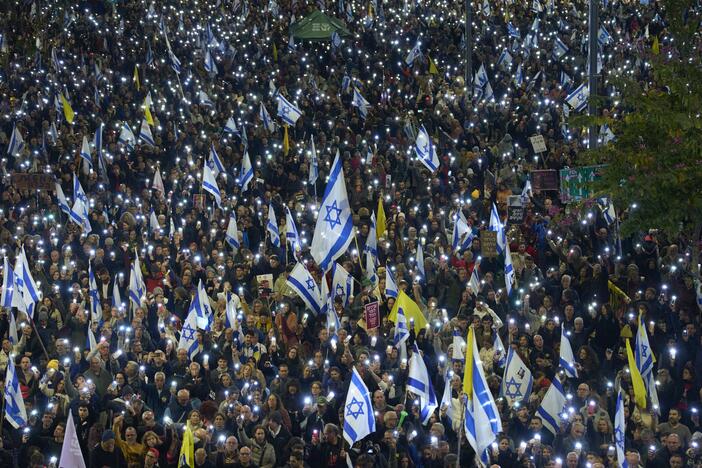 People take part in a protest demanding the immediate release of hostages held by Hamas in the Gaza Strip, in Tel Aviv, Israel, Saturday, March 22, 2025.