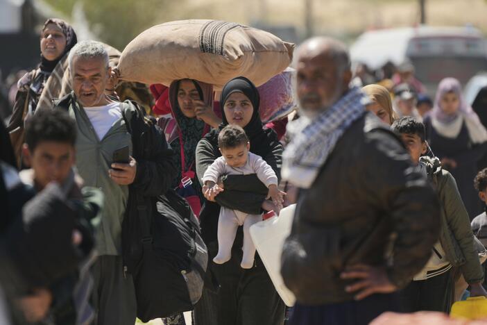 Displaced Palestinians, who flee from Rafah amid ongoing Israeli military operations following Israel's renewed offensive in the Gaza Strip, arrive in Khan Younis, Gaza, on Sunday.