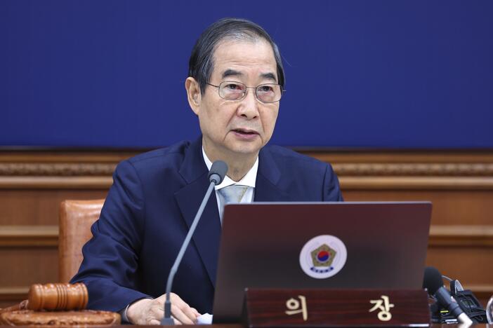 South Korea's Prime Minister Han Duck-soo, who became the country's acting leader after President Yoon Suk Yeol's impeachment, is shown speaking during a cabinet meeting at the government complex in Seoul, South Korea, on Dec. 24, 2024.