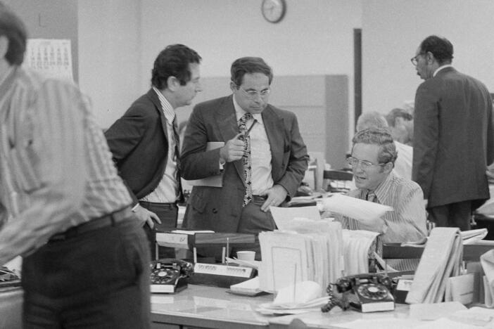 The city room of <em>The New York Times</em> is pictured on June 15, 1971. From left are <em>Times</em> editors James L. Greenfield, foreign editor; Max Frankel, chief Washington correspondent; and Fred P. Graham from the <em>Times</em> Washington bureau. Frankel went on to be the paper's top editor.